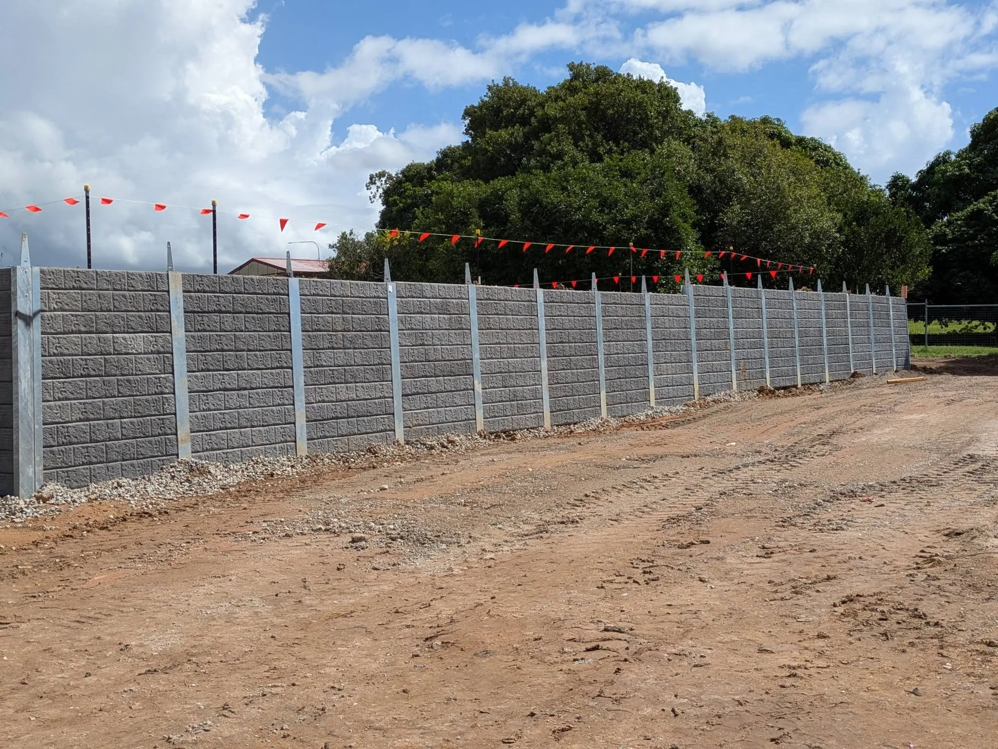Freshly built concrete sleeper retaining wall